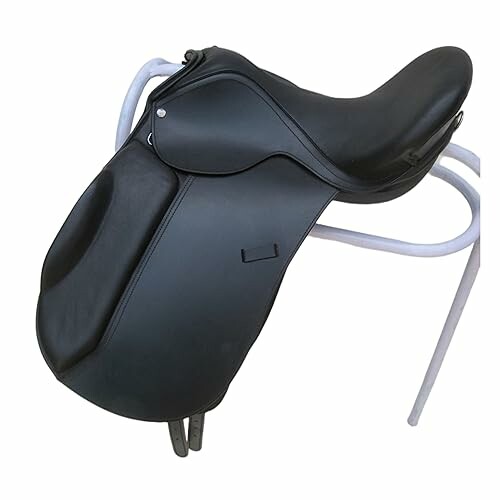 Black dressage saddle on a stand.