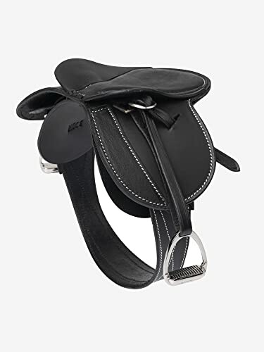 Black leather horse saddle with stirrups