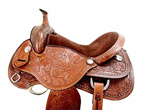 Intricately carved western horse saddle with silver accents.