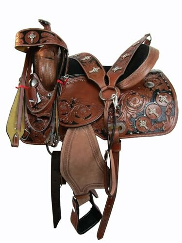 Ornate western leather saddle with intricate tooling